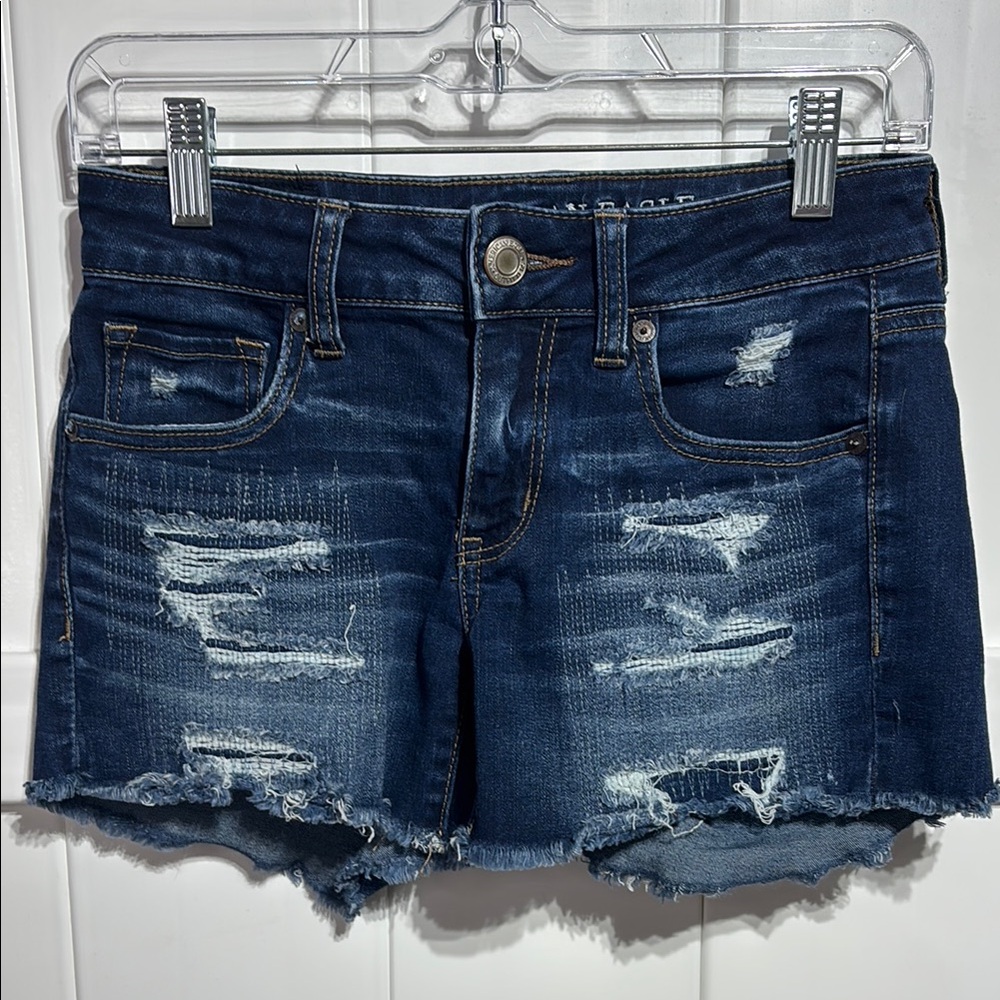 American Eagle distressed midi jean shorts